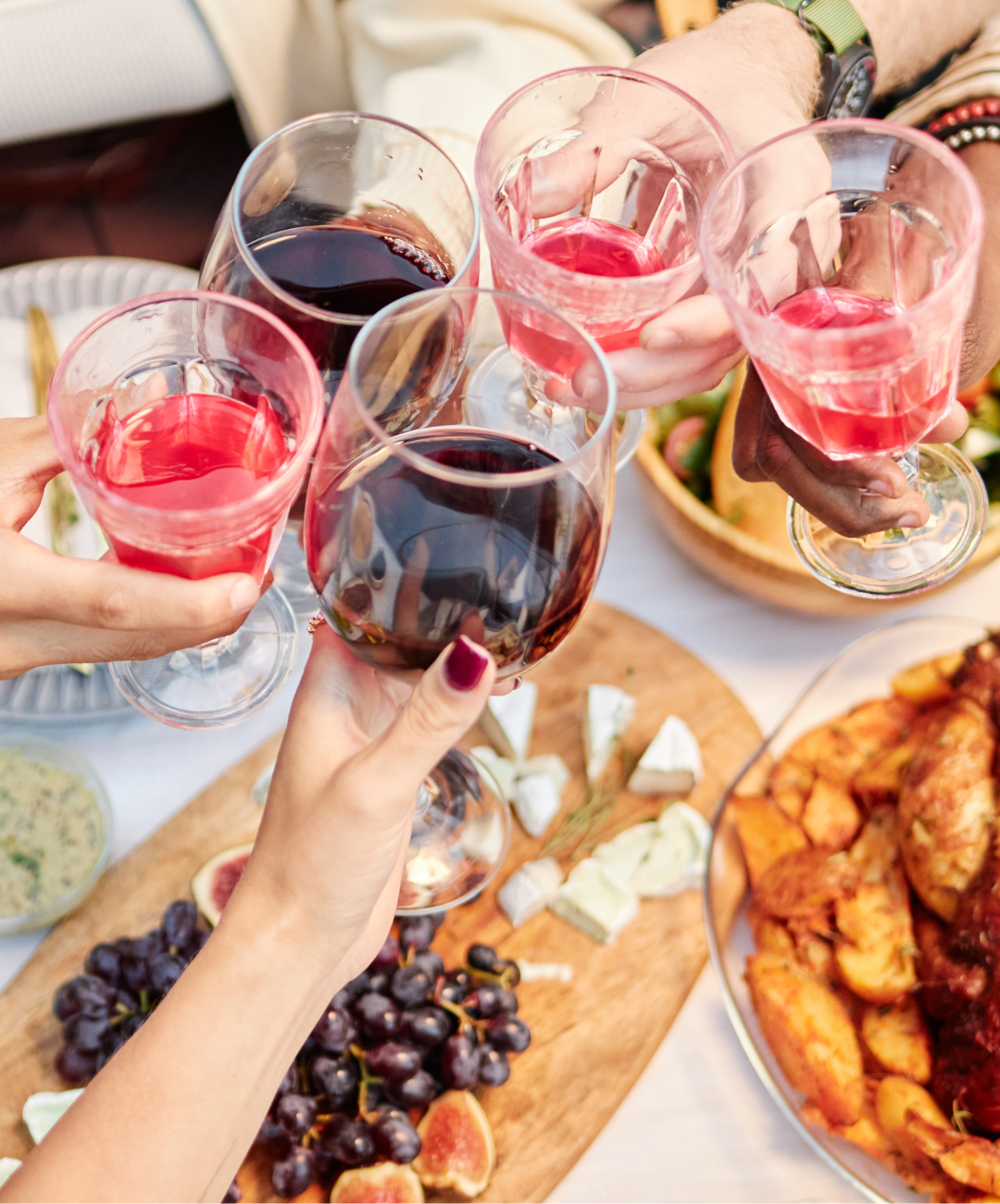 Members toasting with wine at Davison Country Club social gathering